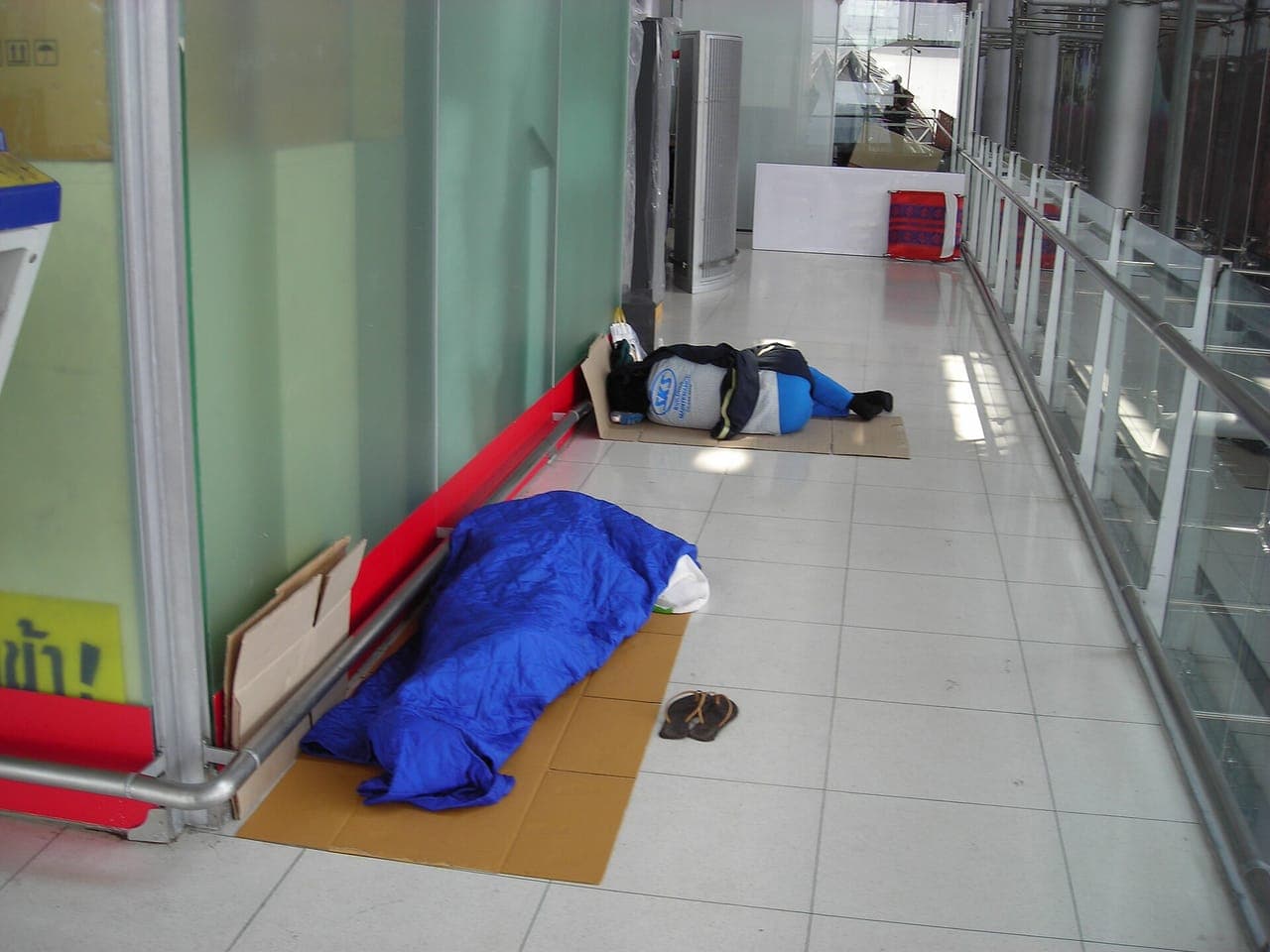 An inflatable sleeping pad and bag laid out inside a tent