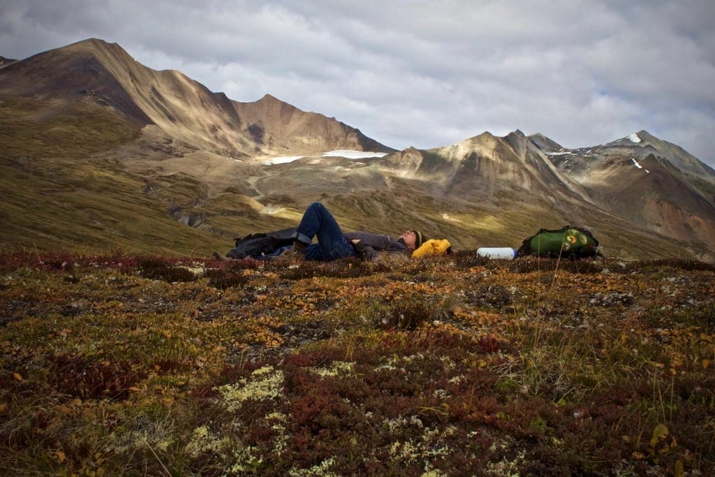 A large family tent beside a small lightweight backpacking tent