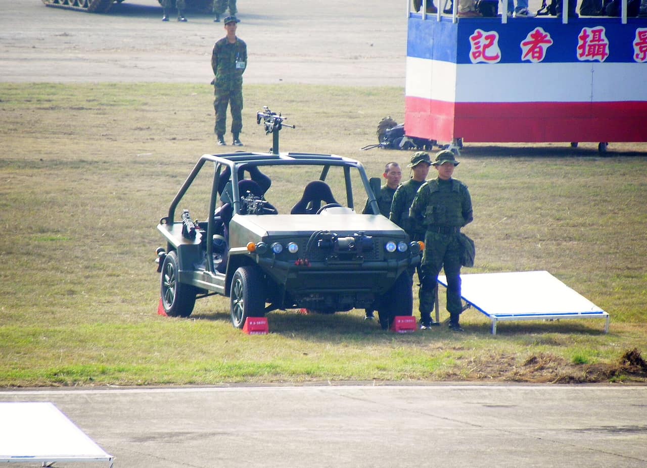 A vehicle set up for camping with gear organized in the cargo area