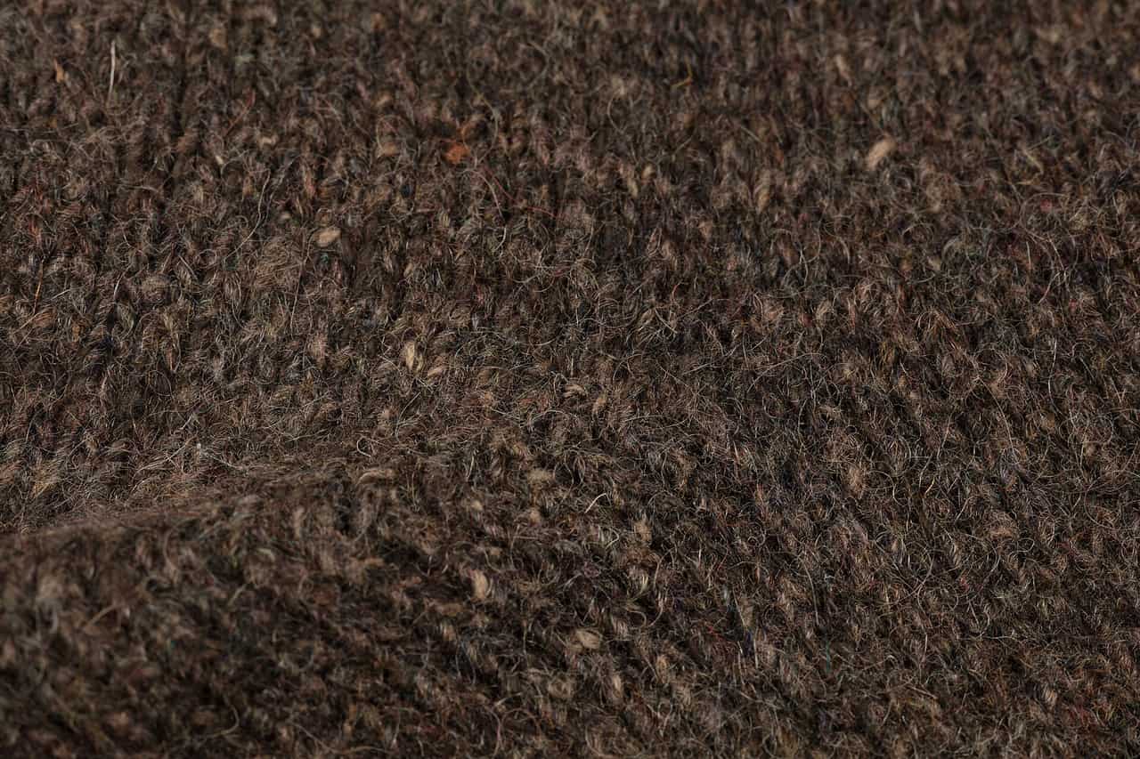 Wool hiking socks beside a pair of hiking boots